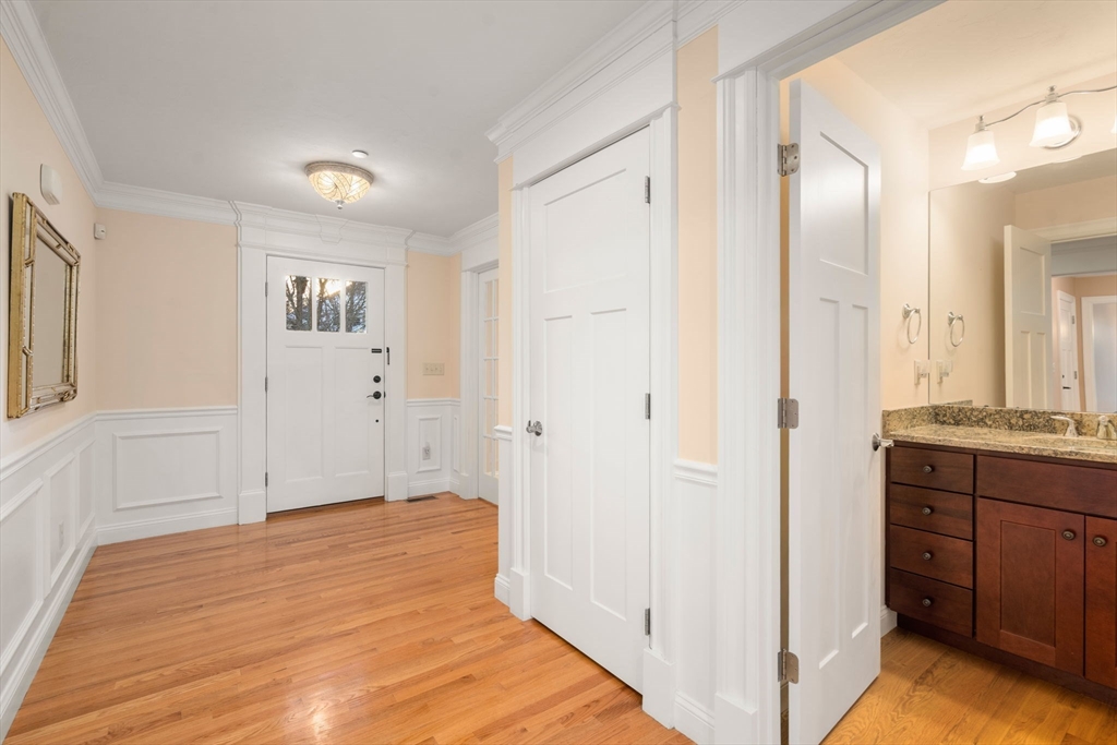 9 River Rock Way, Unit 9 Wayland, MA 01778 - Photo 4 of 39 a view of a bathroom with sink and mirror