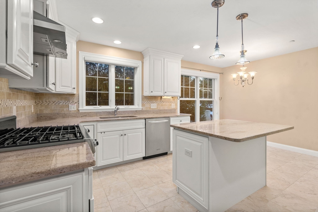9 River Rock Way, Unit 9 Wayland, MA 01778 - Photo 7 of 39 a kitchen that has a sink and a stove