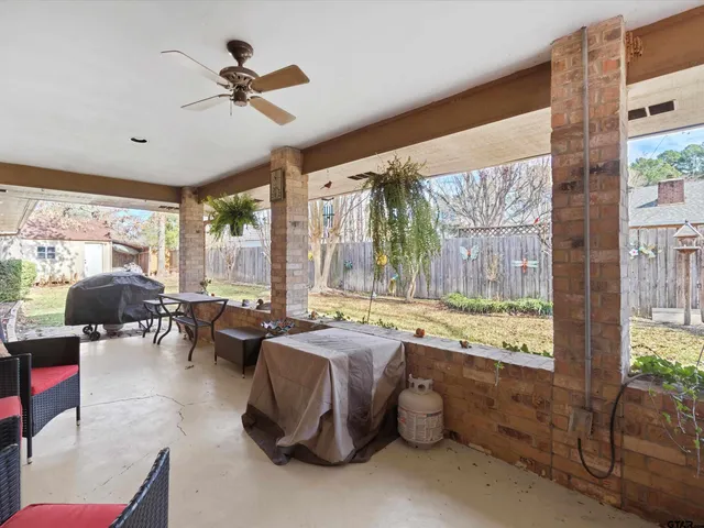 a view of a house with a yard covered in snow