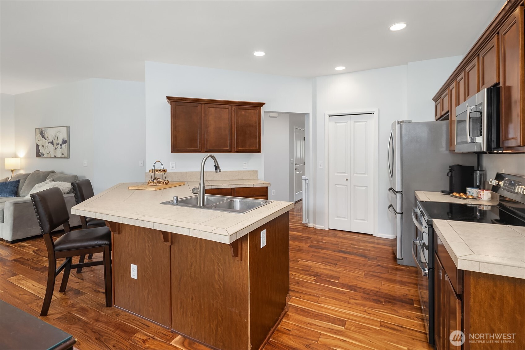 4119 167th Place Southeast Bothell, WA 98012 - Photo 10 of 39 a kitchen with a sink cabinets and wooden floor