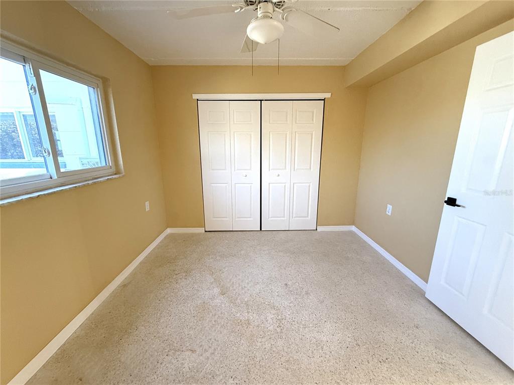 17688 Gulf Boulevard, Unit 102 Redington Shores, FL 33708 - Photo 7 of 14 a view of an empty room with a window