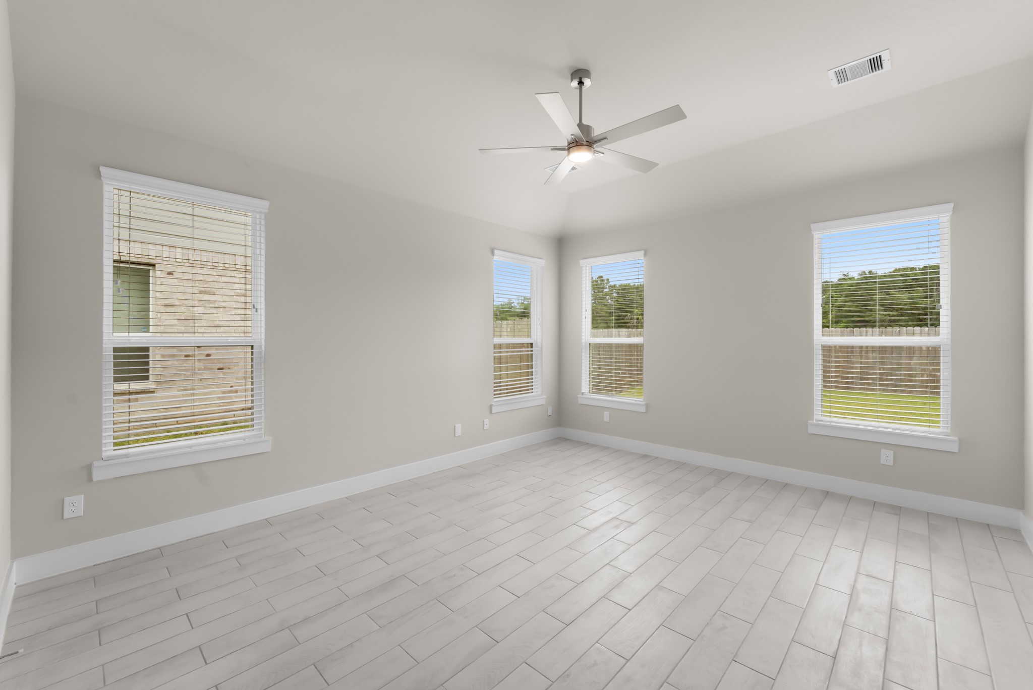 18423 Windy Knl Way Houston, TX 77084 - Photo 15 of 39 a view of an empty room with a window and wooden floor