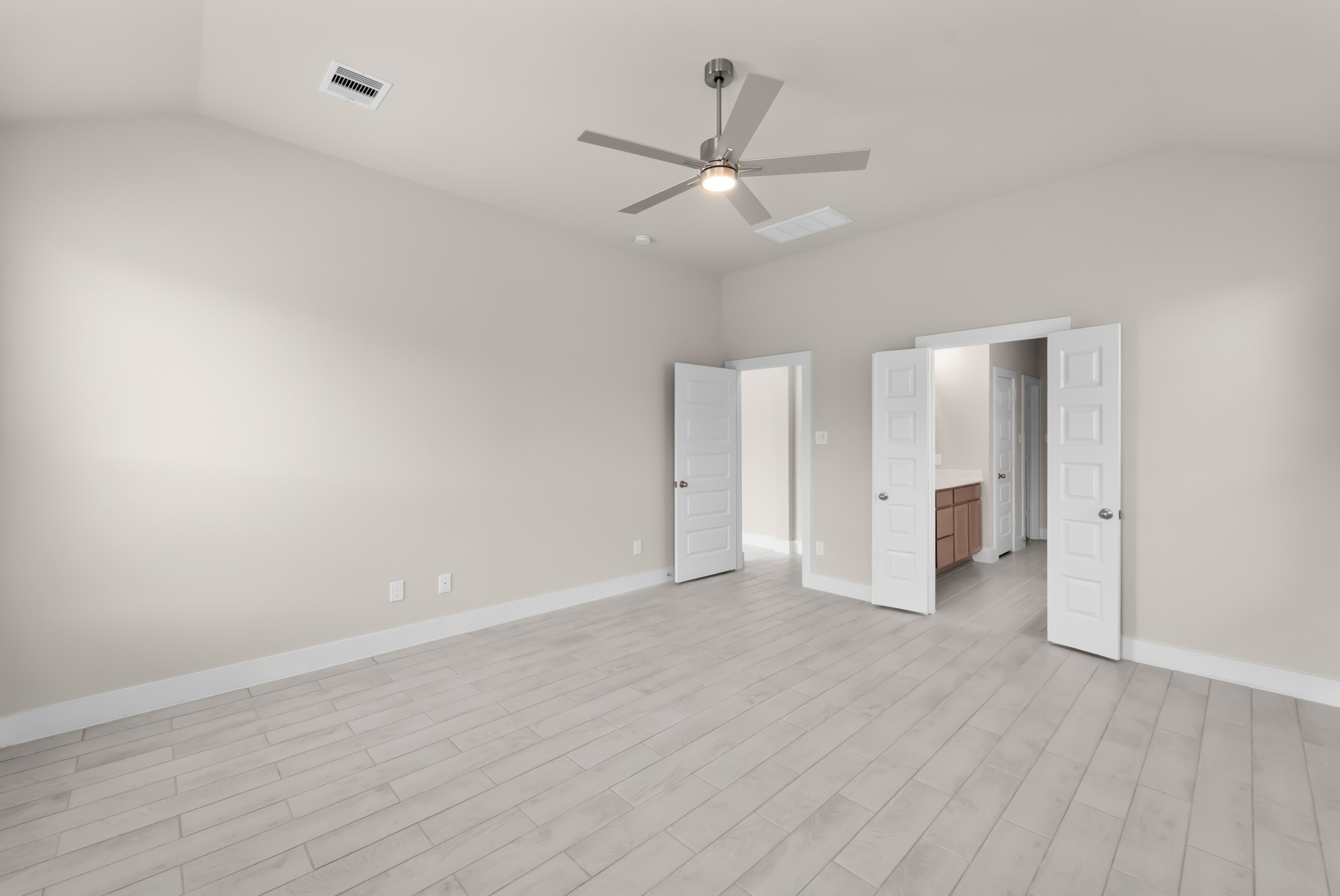 18423 Windy Knl Way Houston, TX 77084 - Photo 16 of 39 a view of an empty room with wooden floor