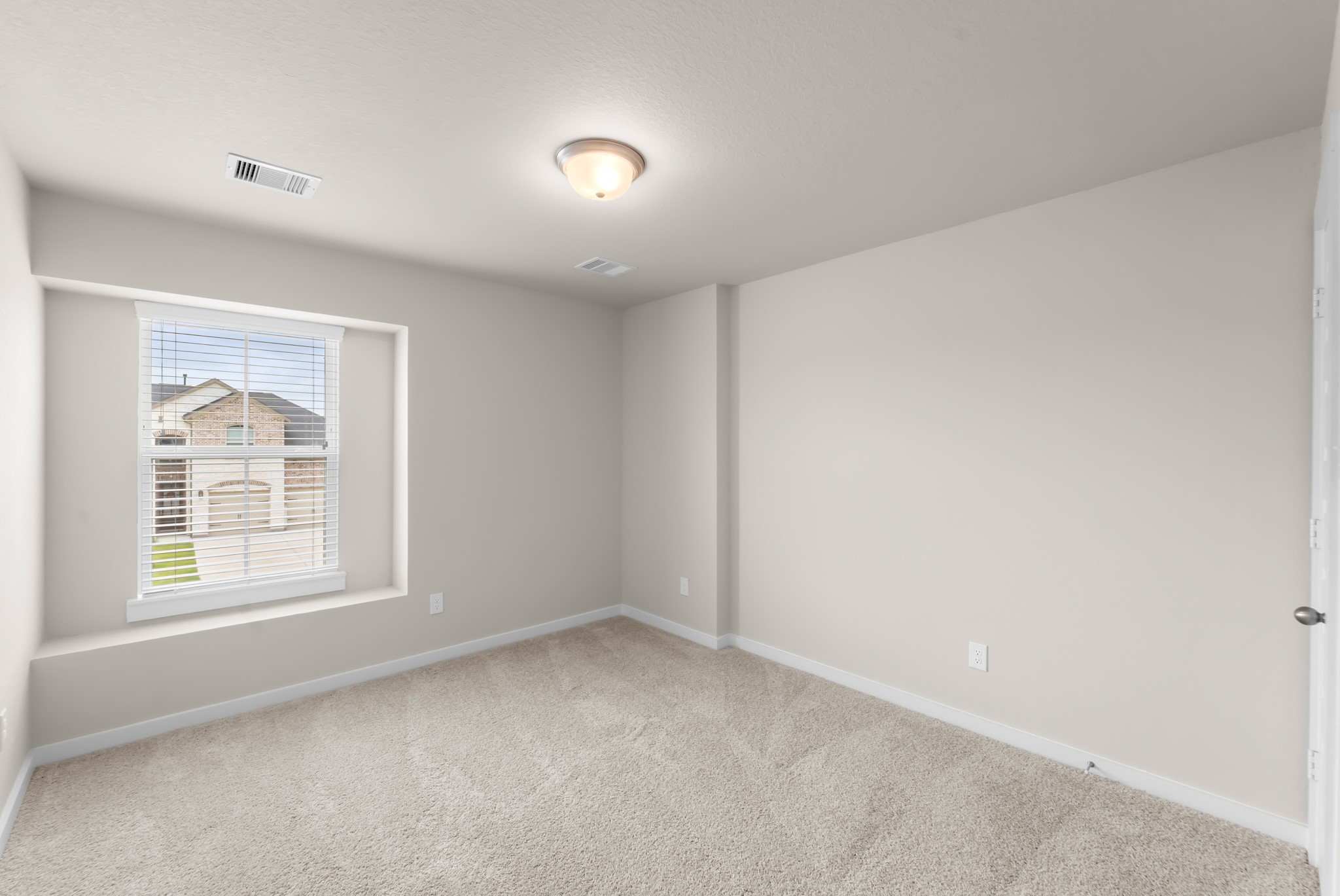 18423 Windy Knl Way Houston, TX 77084 - Photo 31 of 39 an empty room with a window