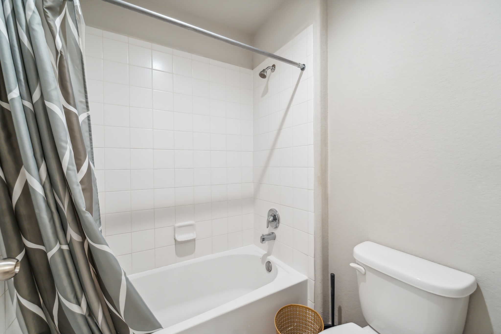 18423 Windy Knl Way Houston, TX 77084 - Photo 35 of 39 a white toilet sitting next to a bath tub