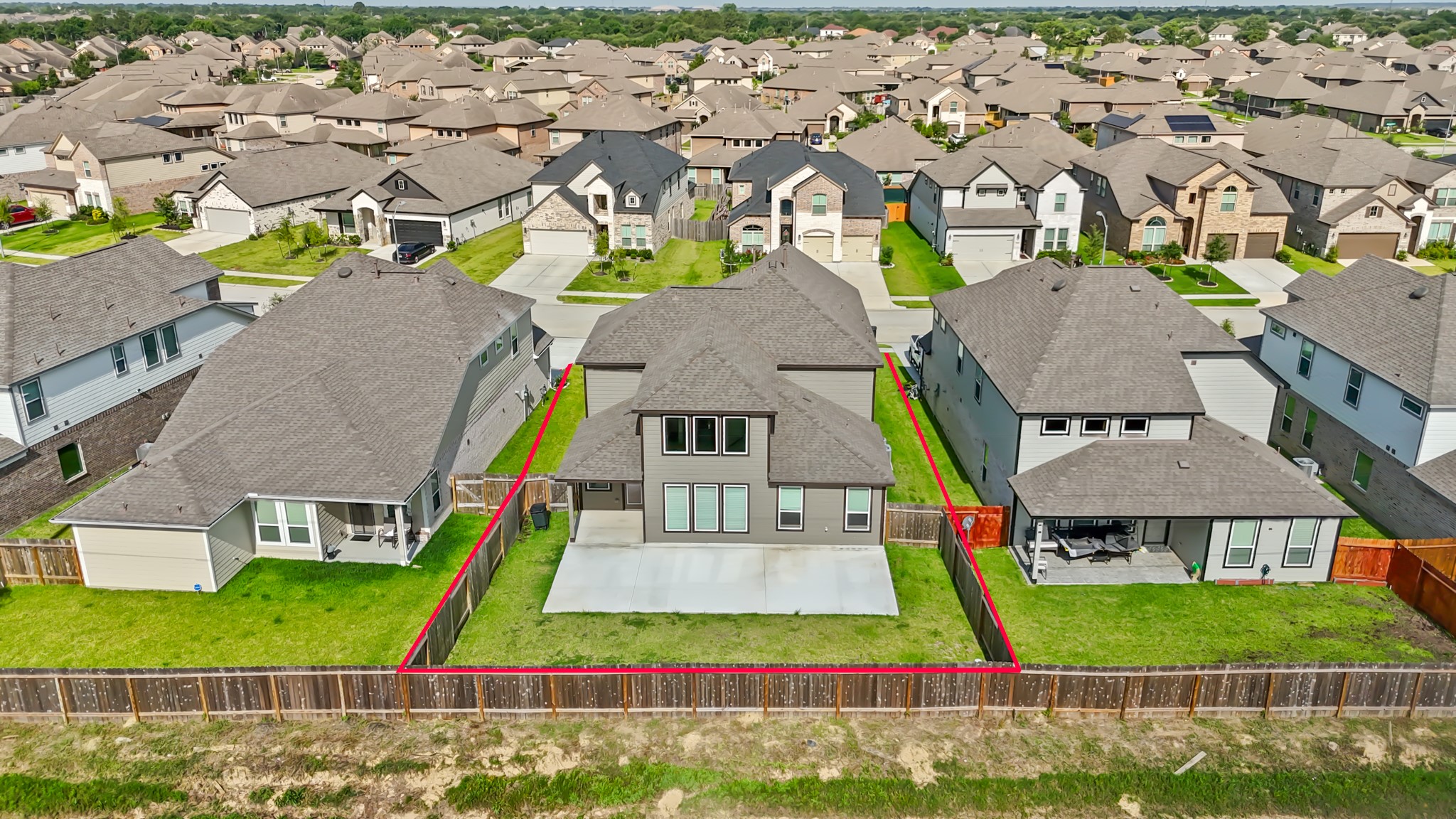 18423 Windy Knl Way Houston, TX 77084 - Photo 38 of 39 an aerial view of multiple houses with a yard
