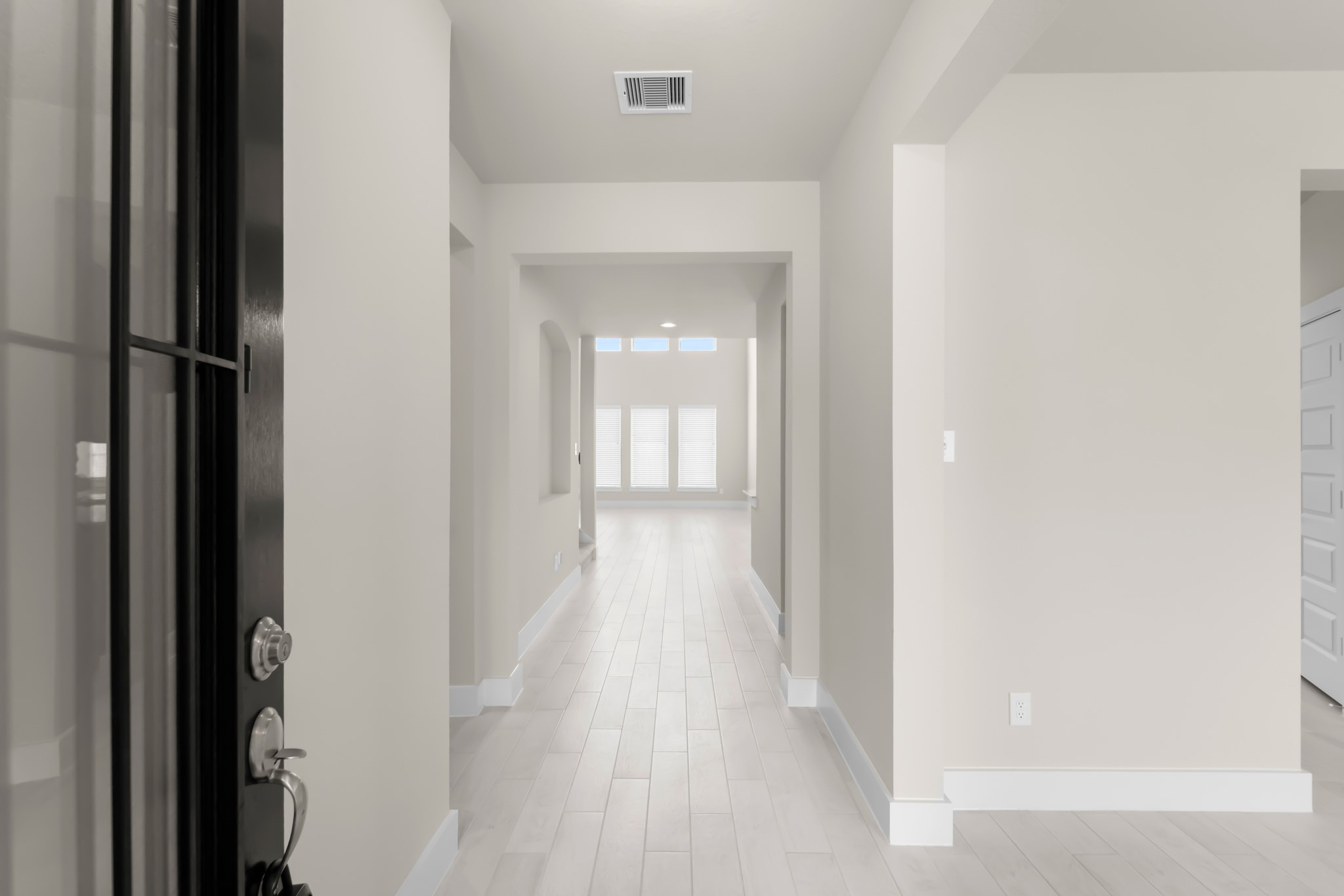 18423 Windy Knl Way Houston, TX 77084 - Photo 5 of 39 a view of a hallway with wooden floor