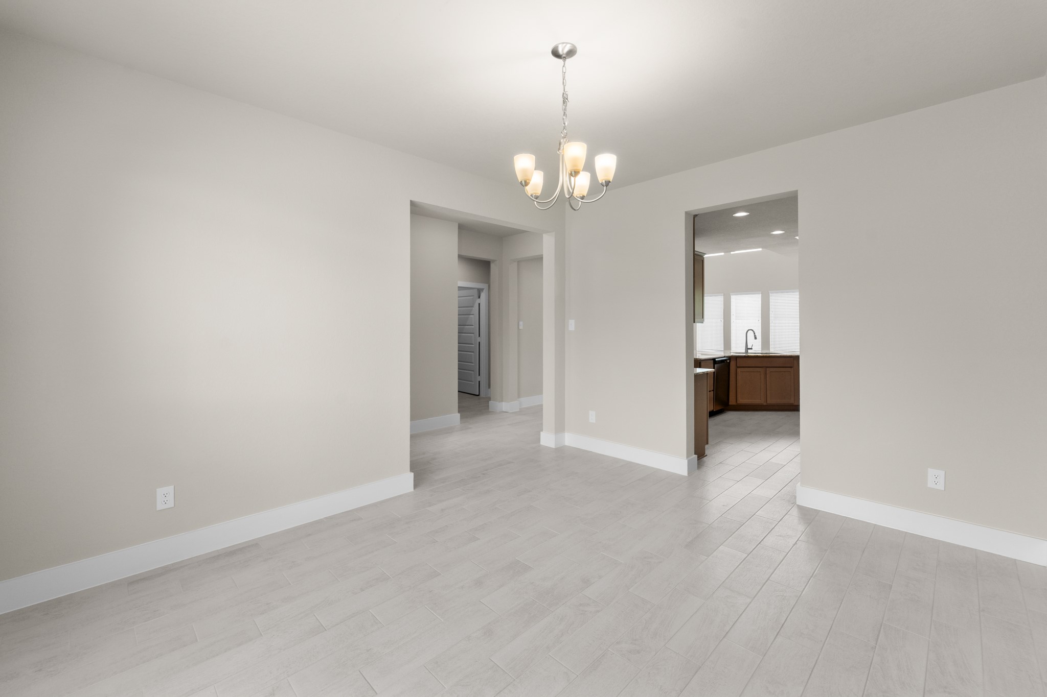 18423 Windy Knl Way Houston, TX 77084 - Photo 7 of 39 wooden floor in an empty room with a window