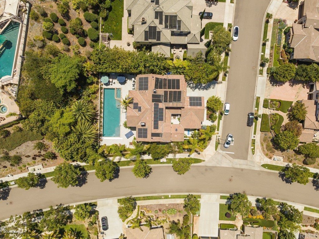 7338 Corte TOMILLO Carlsbad, CA 92009 - Photo 11 of 36 an aerial view of a residential apartment building with swimming pool