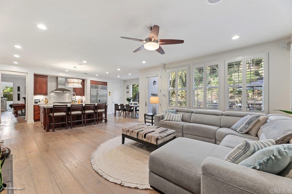 7338 Corte TOMILLO Carlsbad, CA 92009 - Photo 7 of 36 a living room with furniture and a large window
