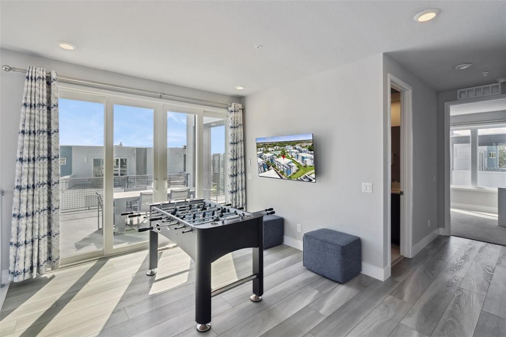 7770 Sandy Ridge Drive, Unit 223 Reunion, FL 34747 - Photo 21 of 51 a room with furniture and large windows