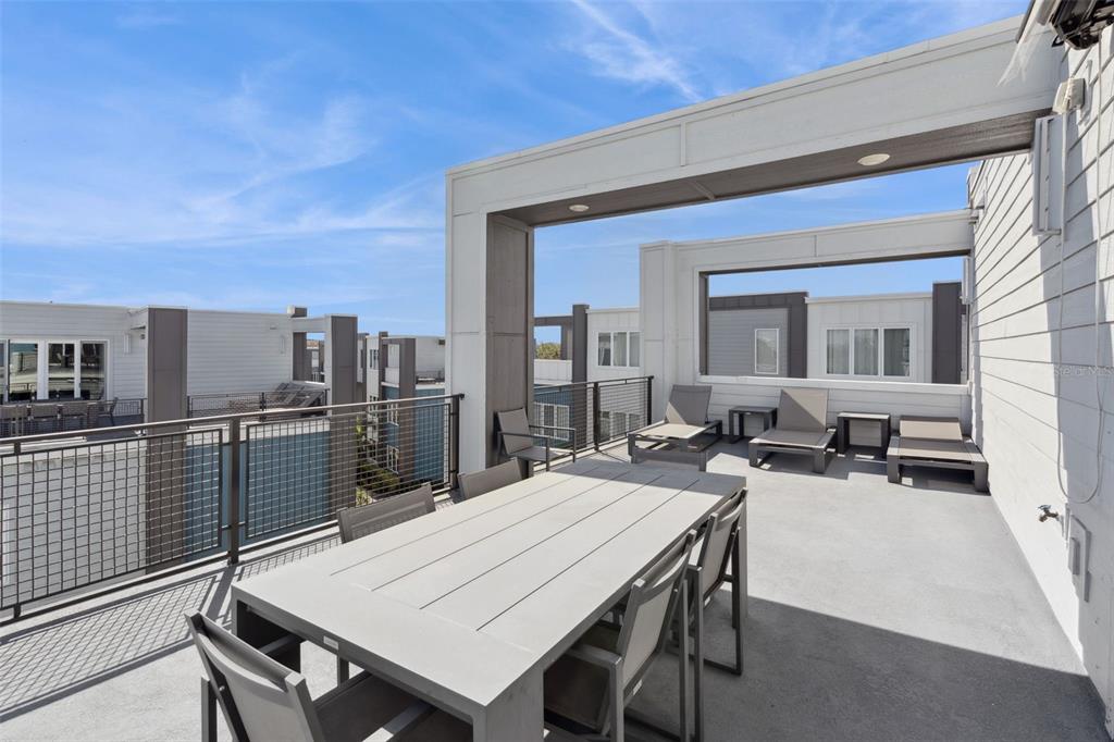 7770 Sandy Ridge Drive, Unit 223 Reunion, FL 34747 - Photo 30 of 51 a view of a patio with a table and chairs