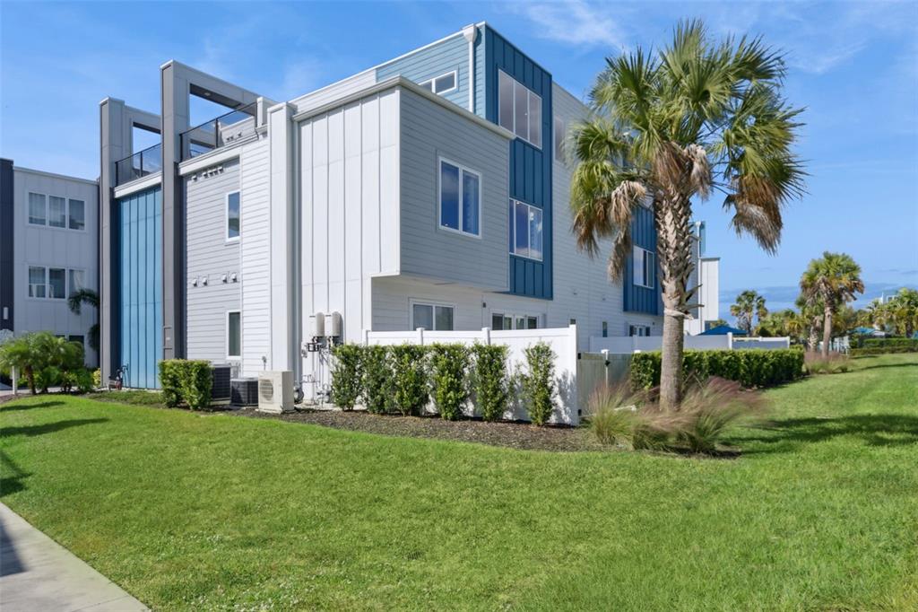 7770 Sandy Ridge Drive, Unit 223 Reunion, FL 34747 - Photo 31 of 51 a front view of a house with a yard