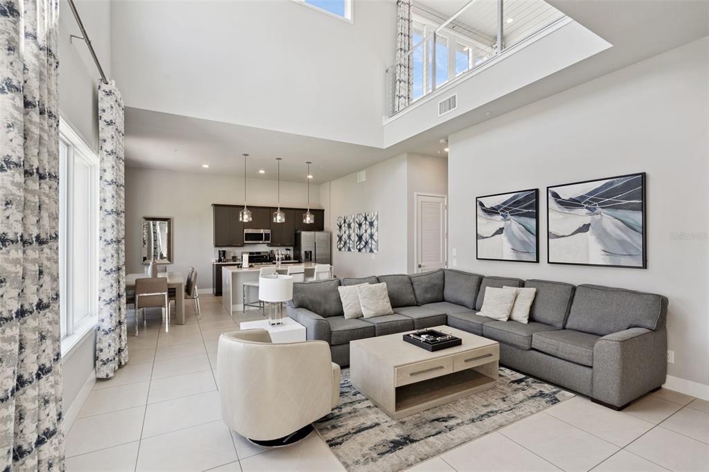7770 Sandy Ridge Drive, Unit 223 Reunion, FL 34747 - Photo 4 of 51 a living room with furniture and a ceiling fan