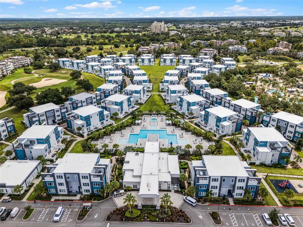 7770 Sandy Ridge Drive, Unit 223 Reunion, FL 34747 - Photo 41 of 51 an aerial view of a building with a swimming pool