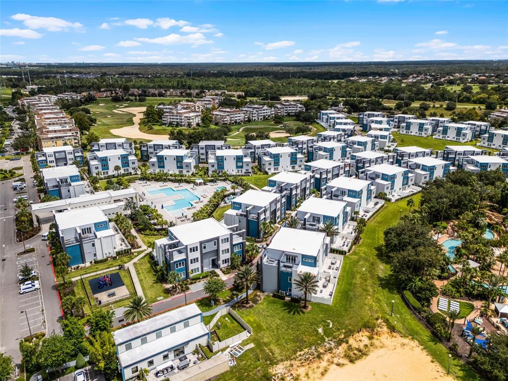 7770 Sandy Ridge Drive, Unit 223 Reunion, FL 34747 - Photo 44 of 51 an aerial view of residential houses with outdoor space