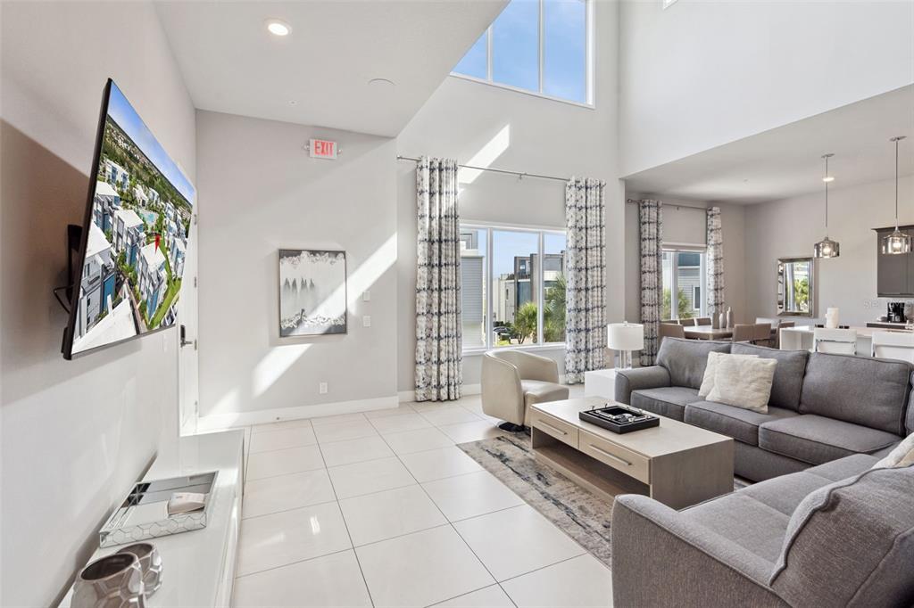 7770 Sandy Ridge Drive, Unit 223 Reunion, FL 34747 - Photo 5 of 51 a living room with furniture and a table