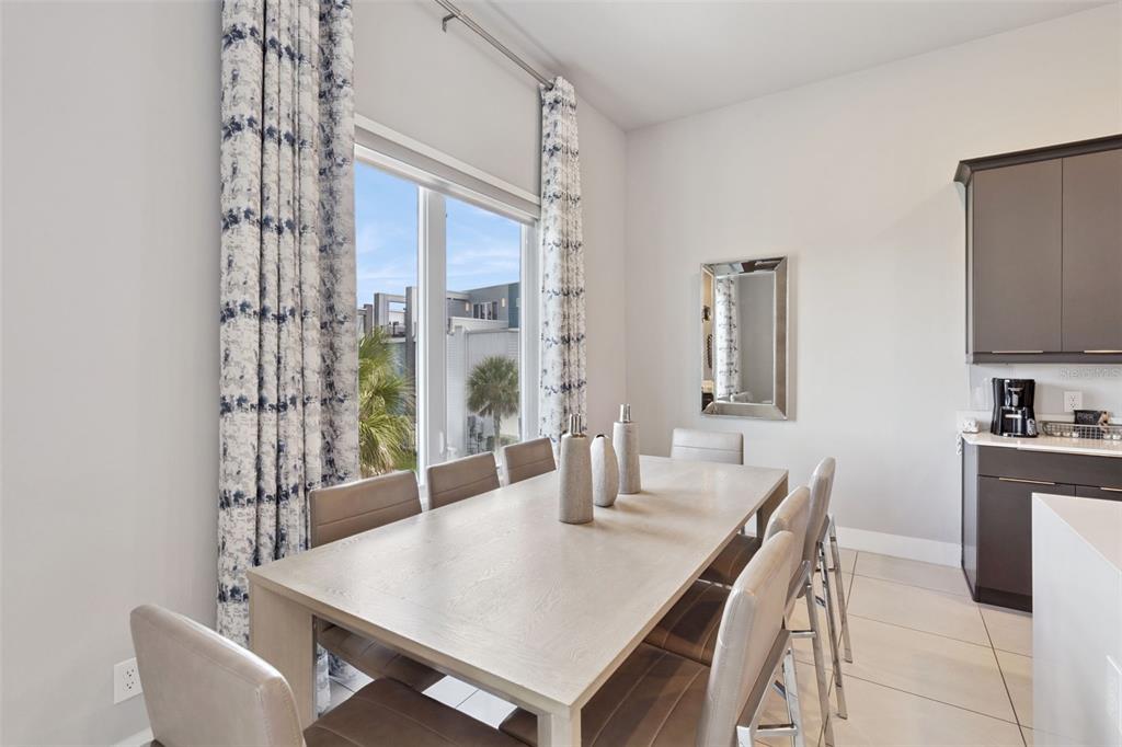7770 Sandy Ridge Drive, Unit 223 Reunion, FL 34747 - Photo 8 of 51 a dining room with furniture and window