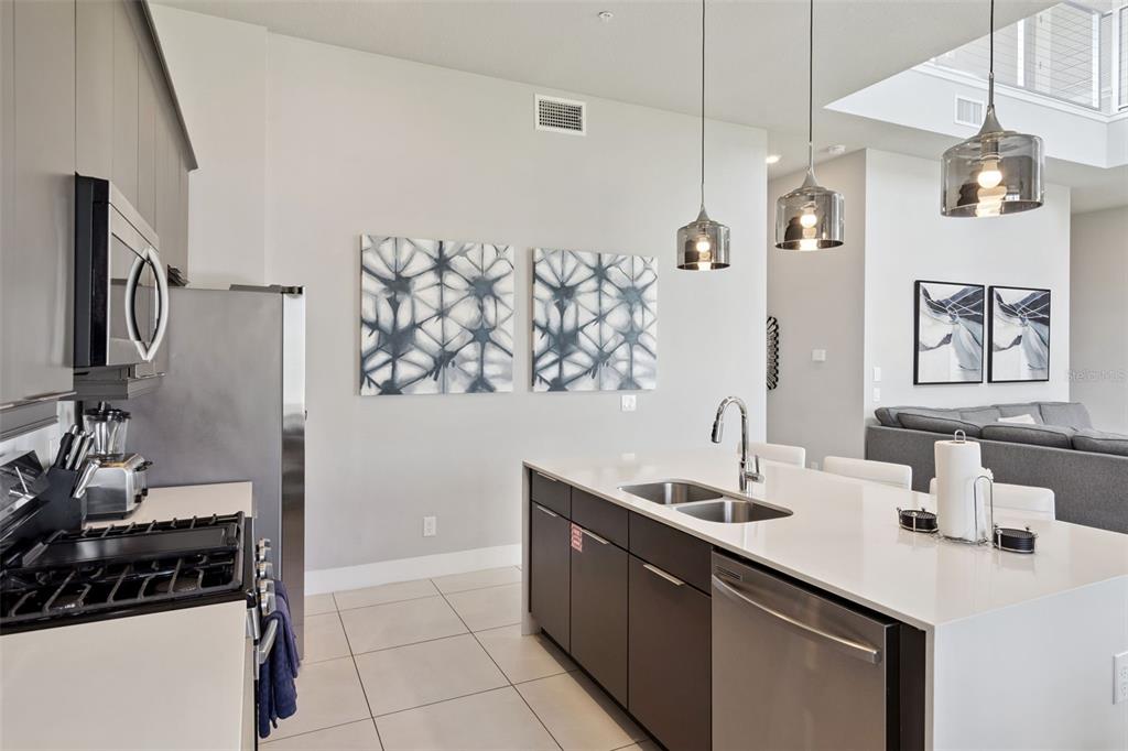 7770 Sandy Ridge Drive, Unit 223 Reunion, FL 34747 - Photo 10 of 51 a bathroom with a sink and a mirror