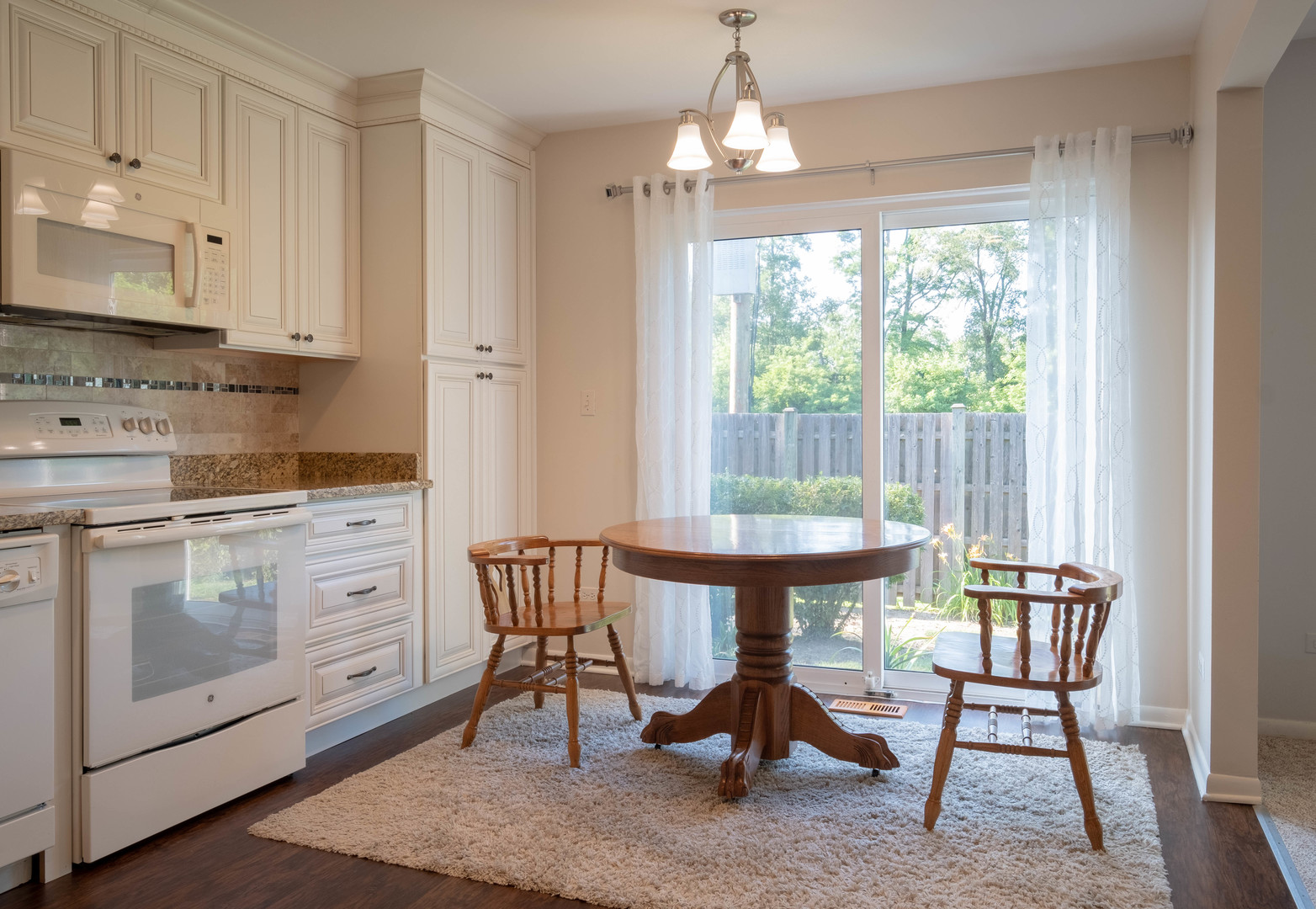 335 Shadow Bend Drive Wheeling, IL 60090 - Photo 2 of 21 a view of a dining room with furniture window and outside view
