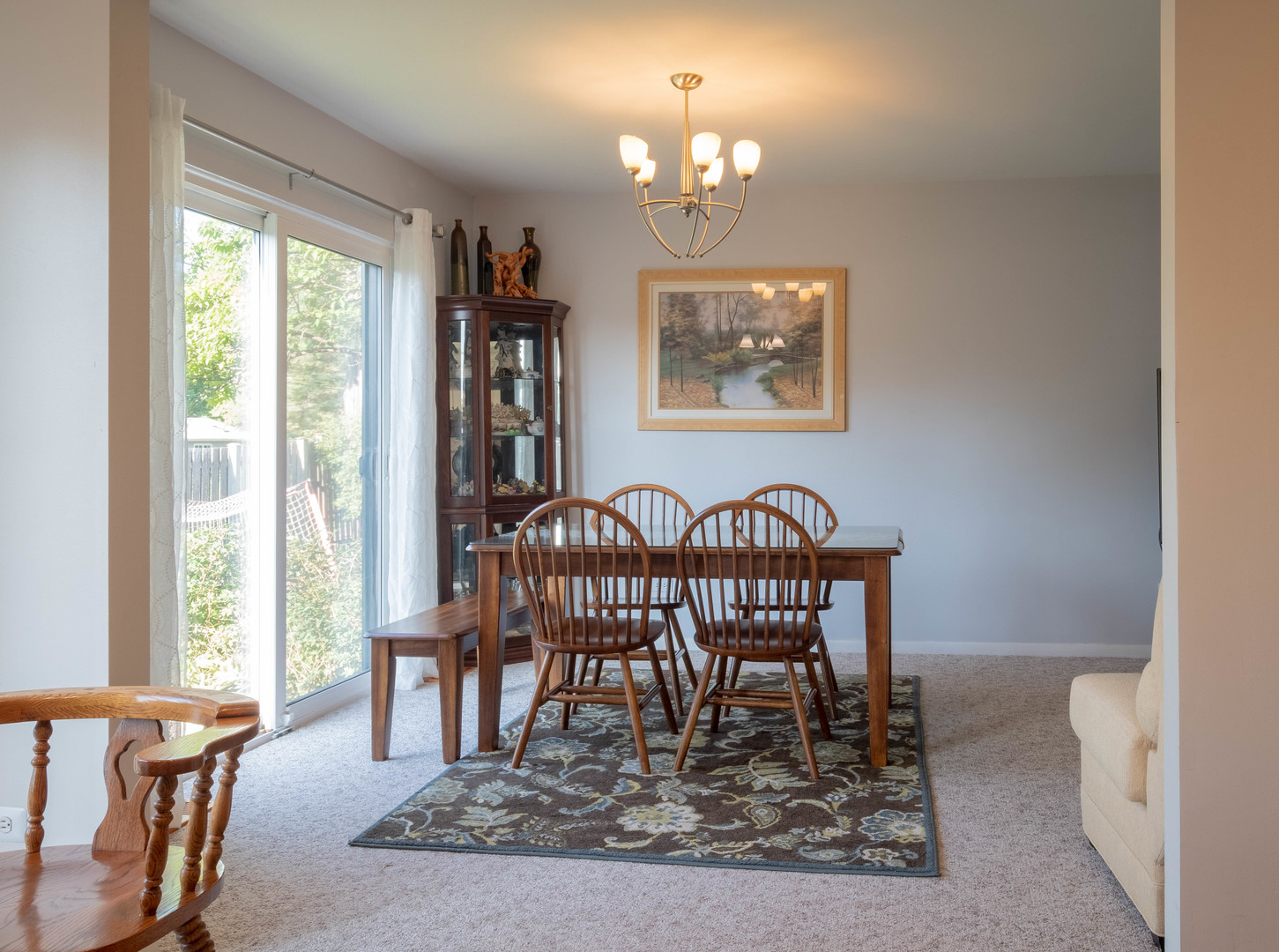 335 Shadow Bend Drive Wheeling, IL 60090 - Photo 6 of 21 a view of a dining room with furniture wooden floor and a chandelier