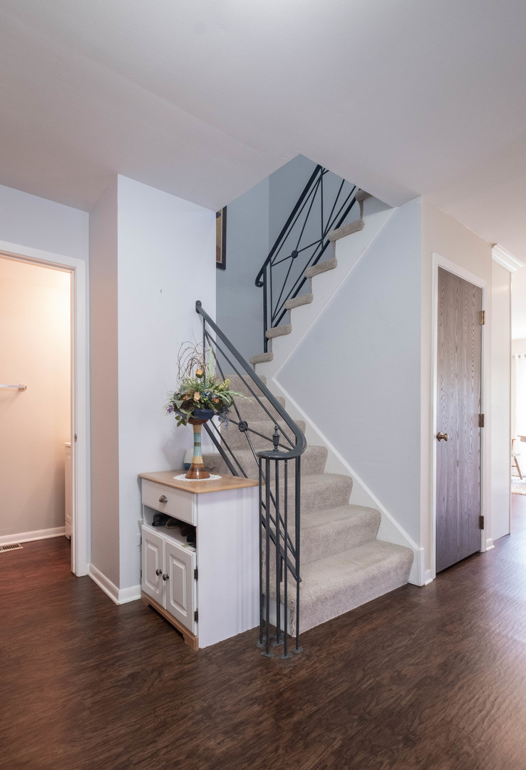 335 Shadow Bend Drive Wheeling, IL 60090 - Photo 8 of 21 a view of entryway and hall with wooden floor