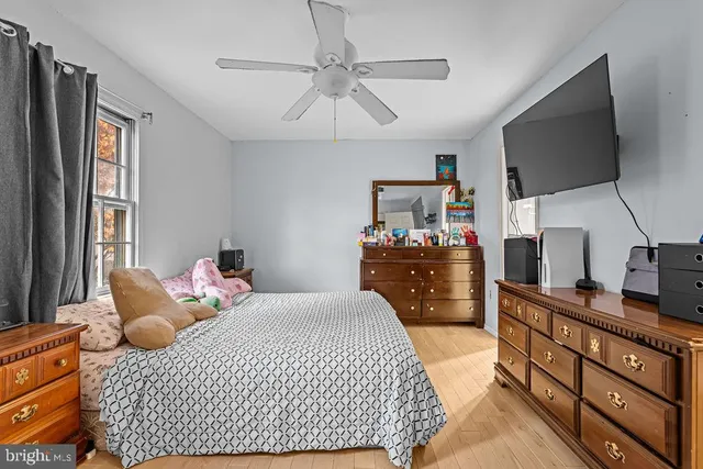 a bedroom with a bed and flat screen tv