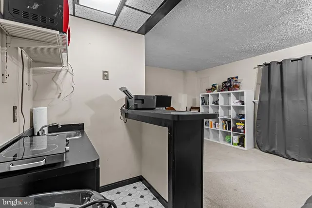 a view of kitchen and sink