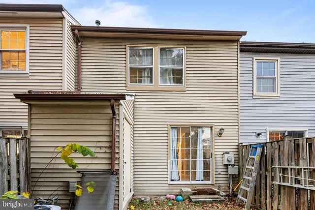 a front view of a house with sitting area