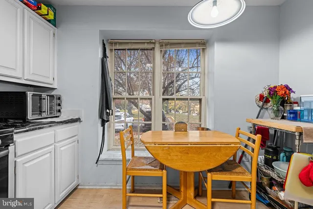 a dining room with furniture and window