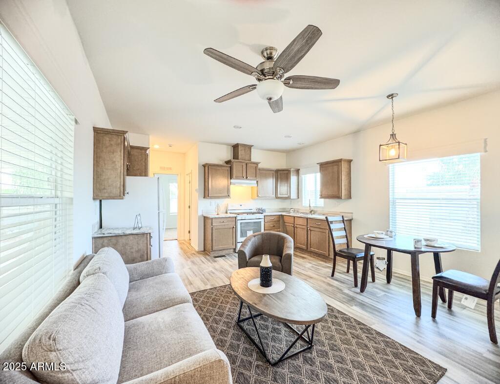 11100 West Alsdorf Road, Unit 66 Arizona City, AZ 85123 - Photo 2 of 7 a living room with furniture and kitchen view
