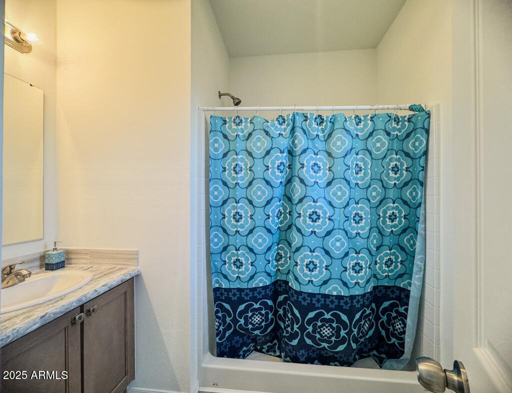 11100 West Alsdorf Road, Unit 66 Arizona City, AZ 85123 - Photo 5 of 7 a bathroom with a sink and a mirror