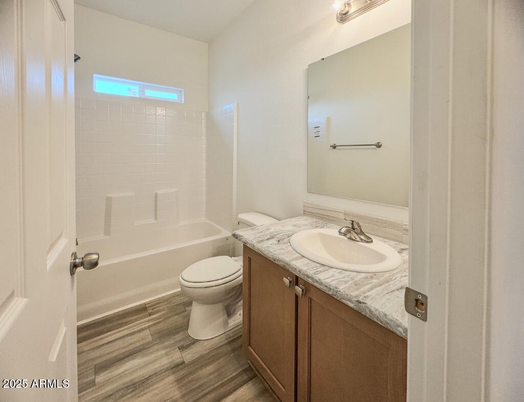 11100 West Alsdorf Road, Unit 66 Arizona City, AZ 85123 - Photo 7 of 7 a bathroom with a sink a toilet and shower