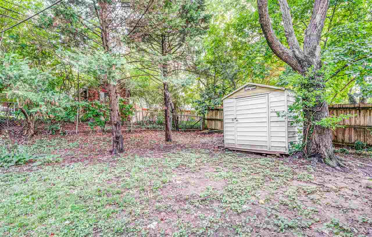 1422 Wilbec Road Memphis, TN 38117 - Photo 21 of 22 a view of a house with a yard and tree s