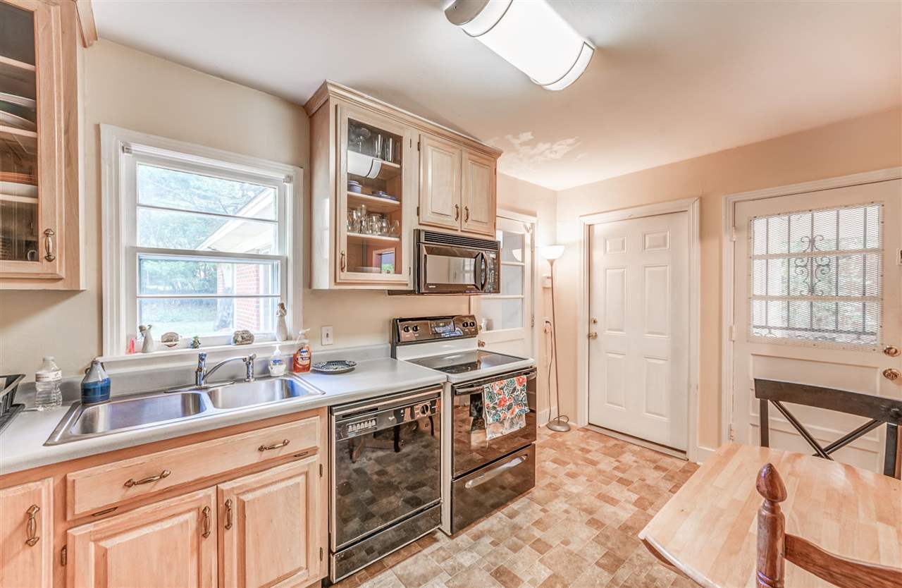 1422 Wilbec Road Memphis, TN 38117 - Photo 5 of 22 a kitchen with stainless steel appliances granite countertop a stove and a sink