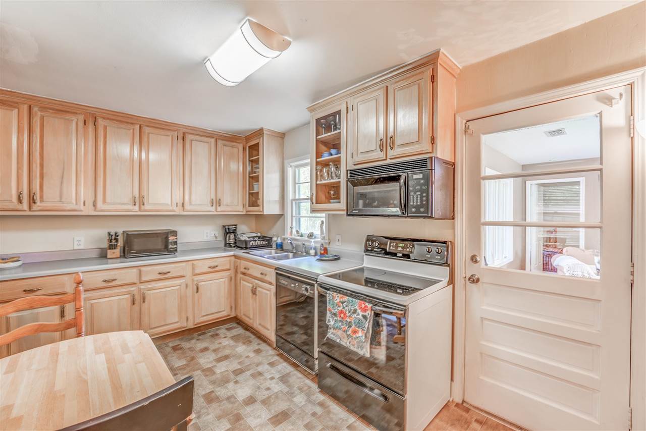 1422 Wilbec Road Memphis, TN 38117 - Photo 6 of 22 a kitchen with stainless steel appliances granite countertop a stove and a sink