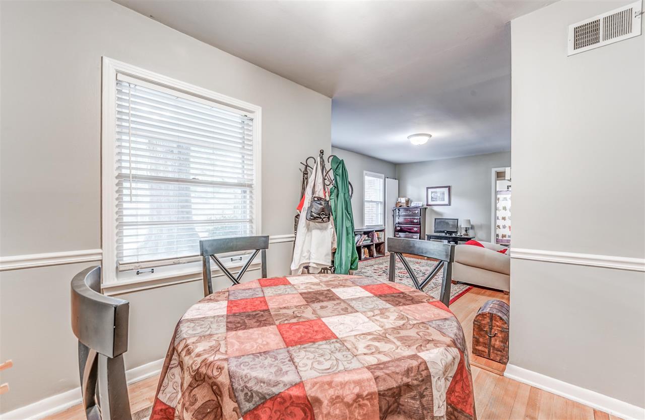 1422 Wilbec Road Memphis, TN 38117 - Photo 9 of 22 a bedroom with a bed a table and chair