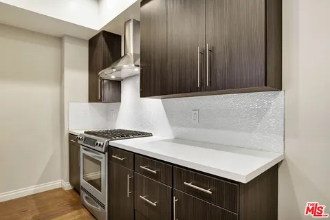 a kitchen with a stove and a microwave