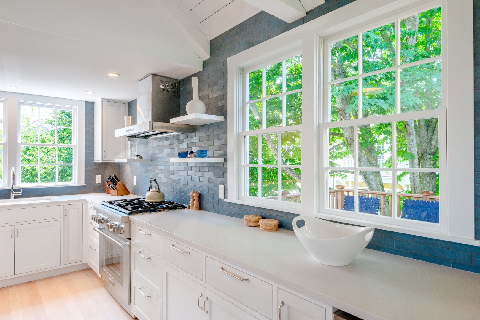 12 Willard Street Nantucket, MA 02554 - Photo 9 of 36 a kitchen with a window a sink and a stove