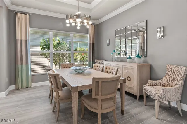 a bedroom with furniture and a large window