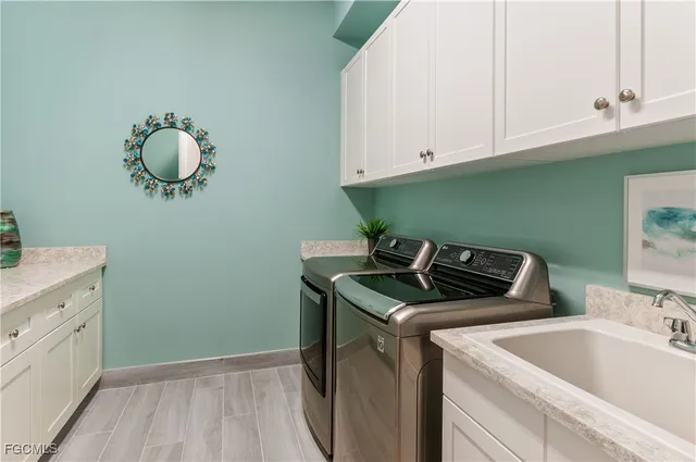 a large dining space with lots of furniture and a chandelier