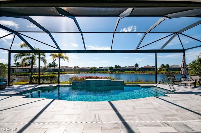 a view of a lake with houses in the background