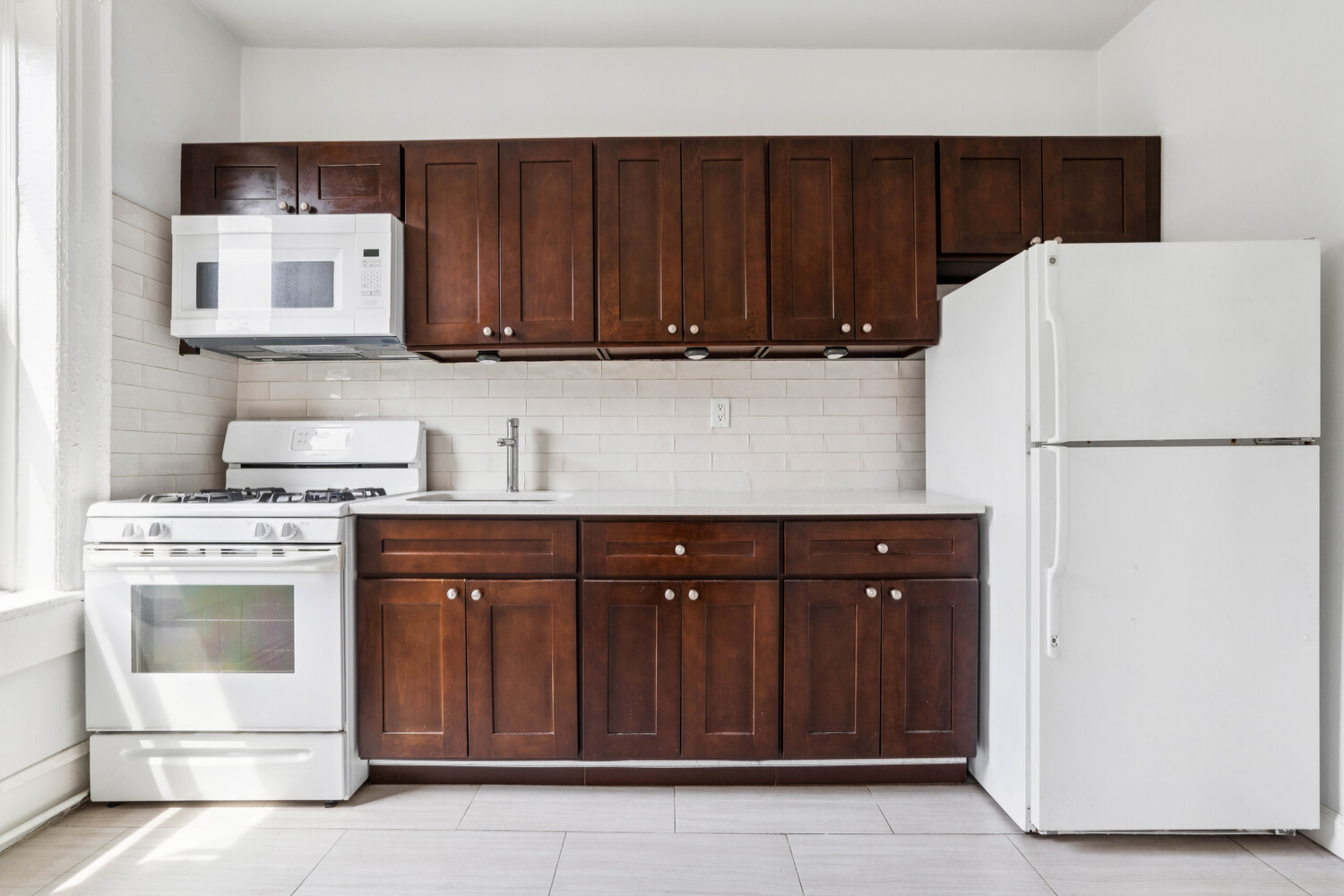 248 Rochester Avenue Brooklyn, NY 11213 - Photo 12 of 21 a kitchen with stainless steel appliances granite countertop a refrigerator a stove a sink and a microwave