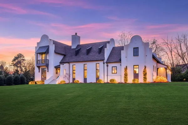 a living room with furniture flat screen tv and a fireplace