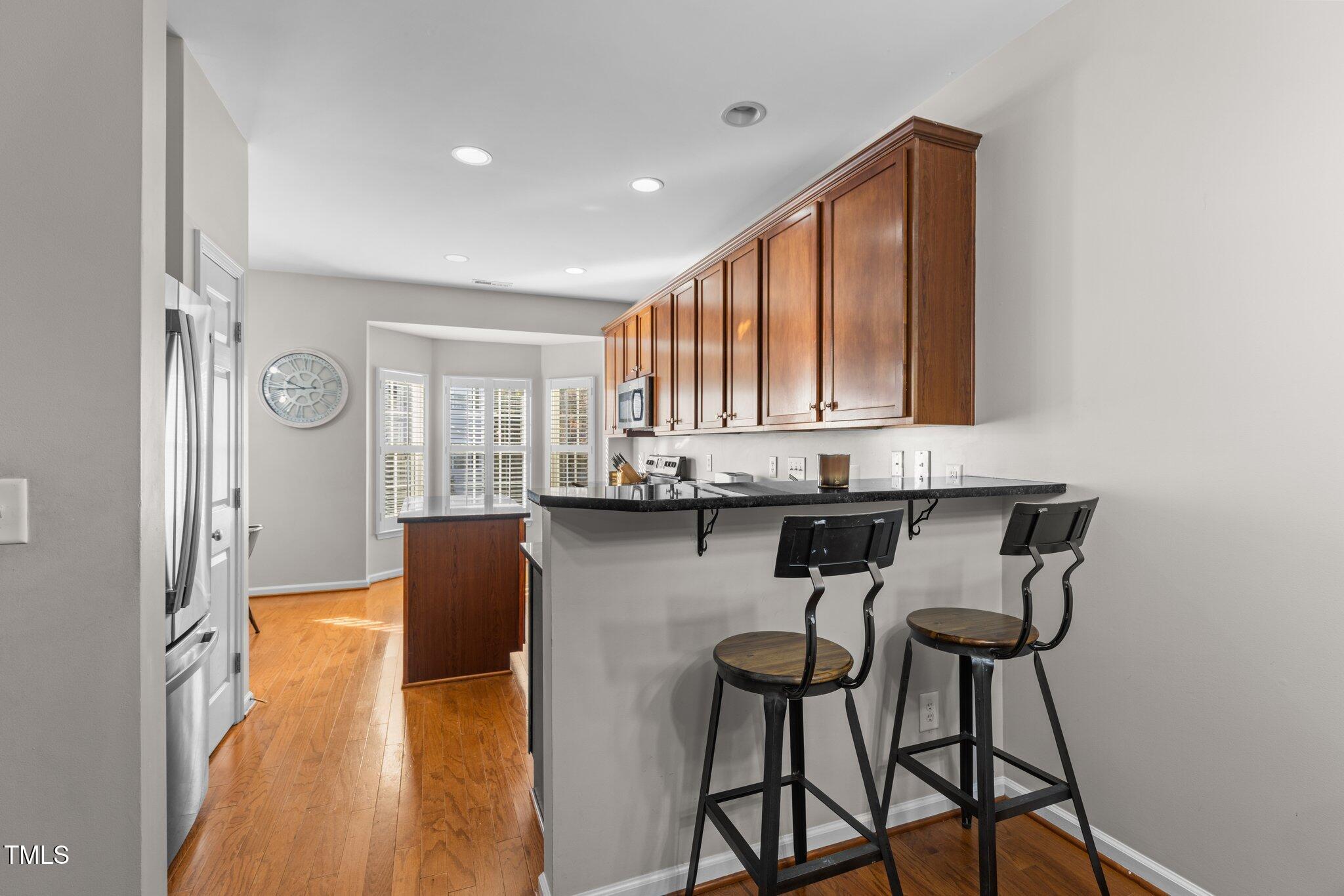 1667 Snow Mass Way Durham, NC 27713 - Photo 11 of 33 a view of kitchen with furniture and wooden floor