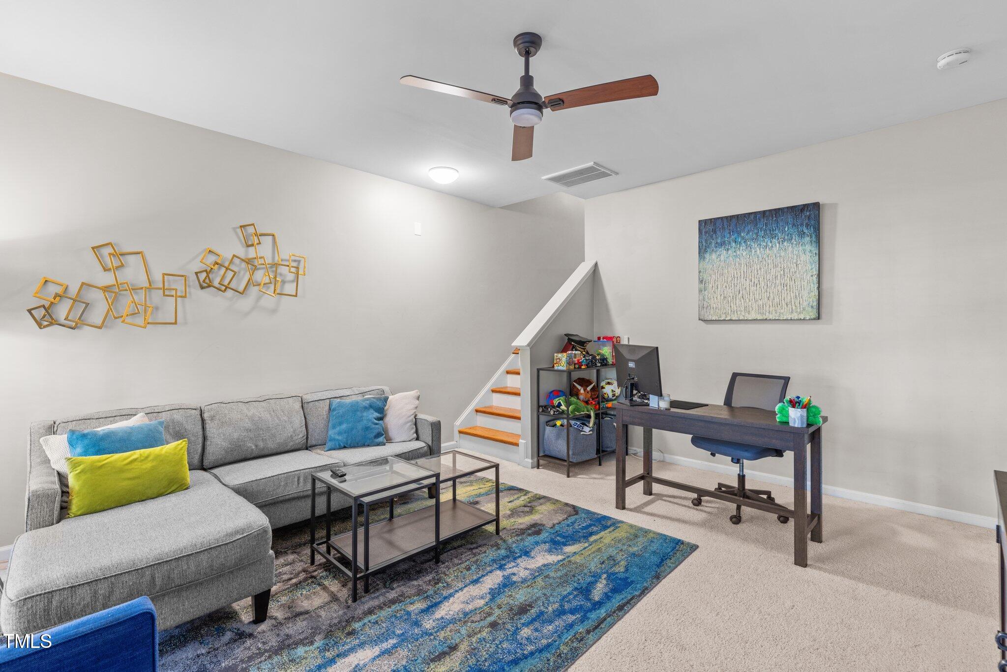 1667 Snow Mass Way Durham, NC 27713 - Photo 17 of 33 a living room with furniture and a rug
