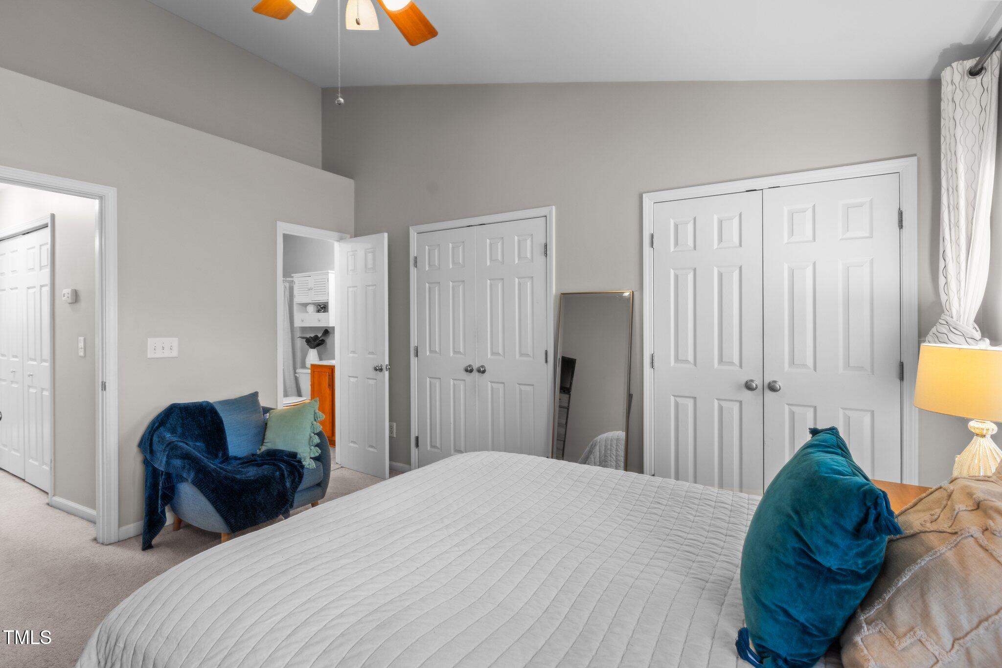 1667 Snow Mass Way Durham, NC 27713 - Photo 20 of 33 a bedroom with a bed and a chandelier