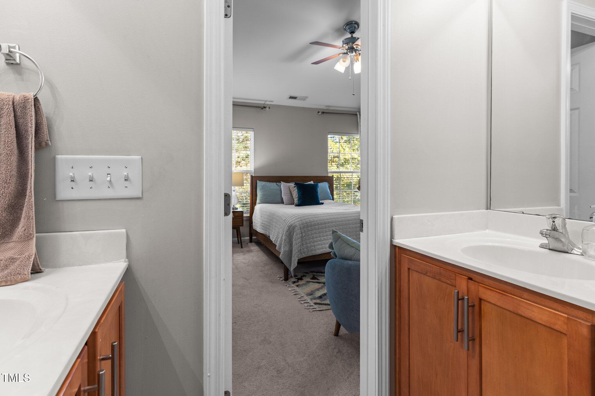 1667 Snow Mass Way Durham, NC 27713 - Photo 22 of 33 a en suite bathroom with a sink and a mirror