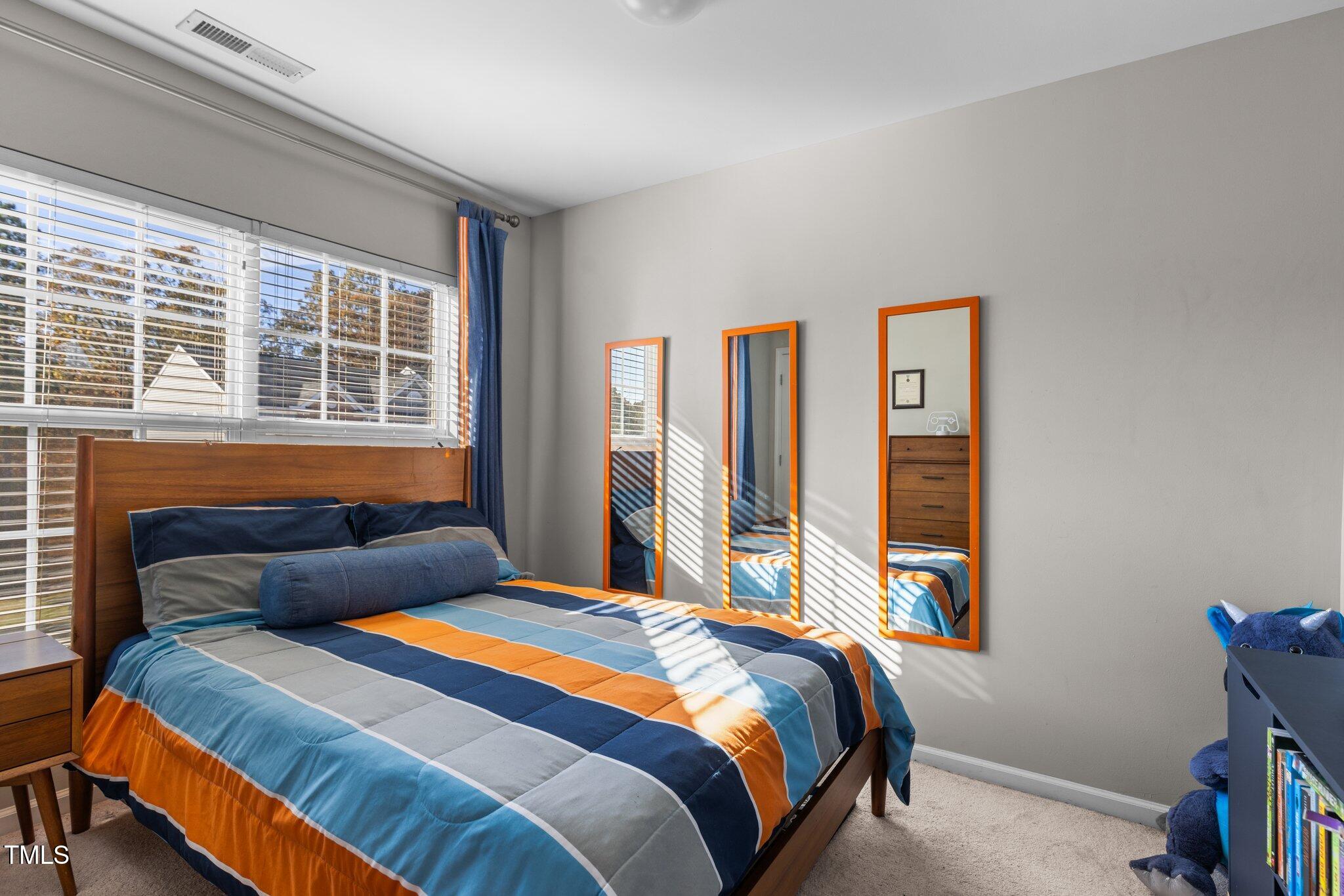 1667 Snow Mass Way Durham, NC 27713 - Photo 23 of 33 a bedroom with a bed and a window