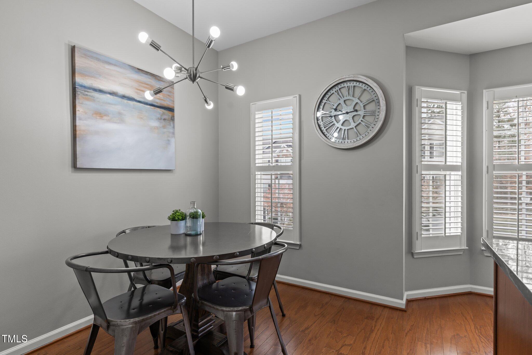 1667 Snow Mass Way Durham, NC 27713 - Photo 9 of 33 a view of a dining room with furniture window and wooden floor